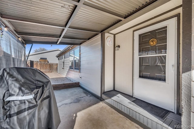 doorway to property with a patio area