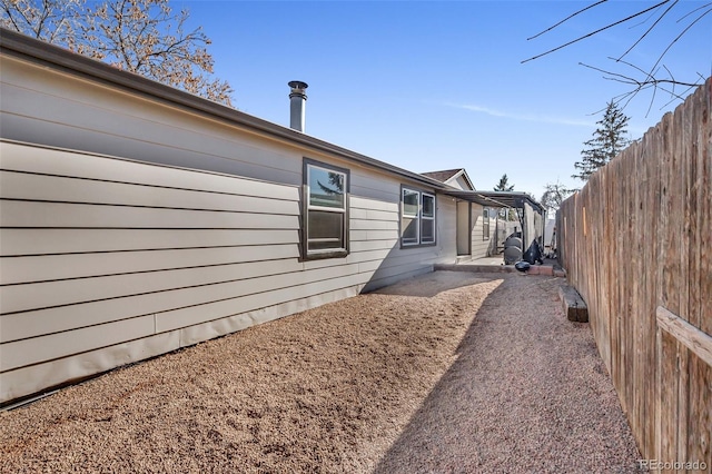 view of side of home featuring a patio area