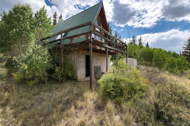 63 Welsh Cob Ln, Jefferson, CO 80456 - back of house featuring a metal roof and a deck