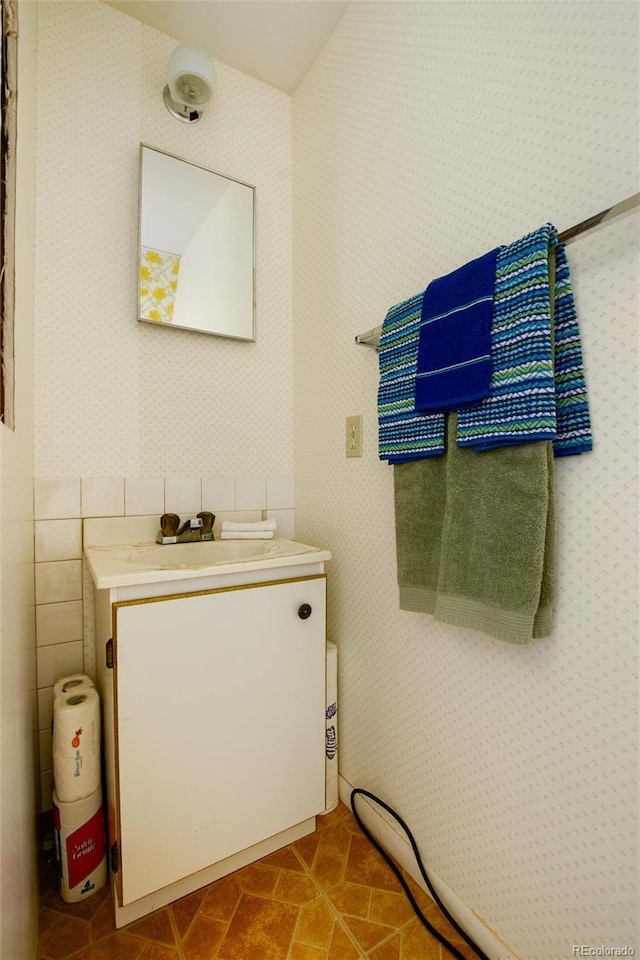 63 Welsh Cob Ln, Jefferson, CO 80456 - bathroom with wallpapered walls and vanity
