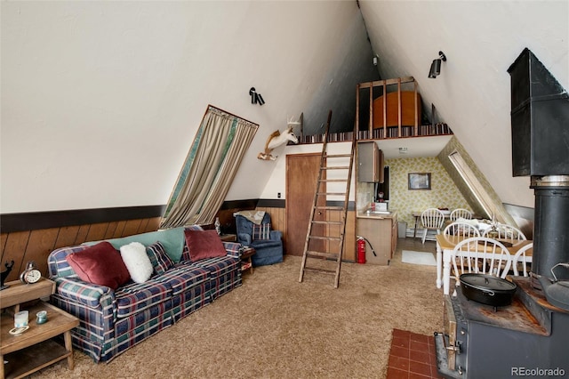 63 Welsh Cob Ln, Jefferson, CO 80456 - carpeted living room with a wainscoted wall, wood walls, and a high ceiling