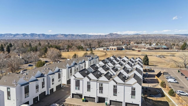 birds eye view of property with a residential view and a mountain view