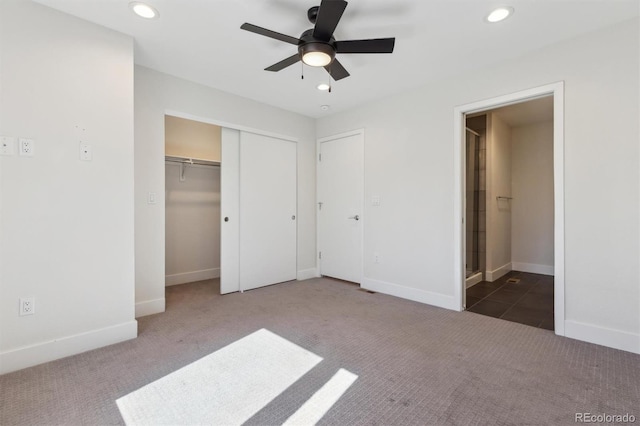 unfurnished bedroom featuring carpet, connected bathroom, baseboards, and recessed lighting