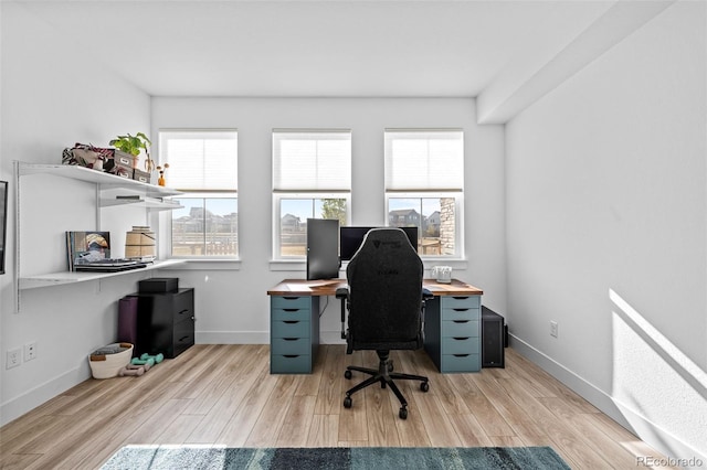 office area with baseboards and wood finished floors