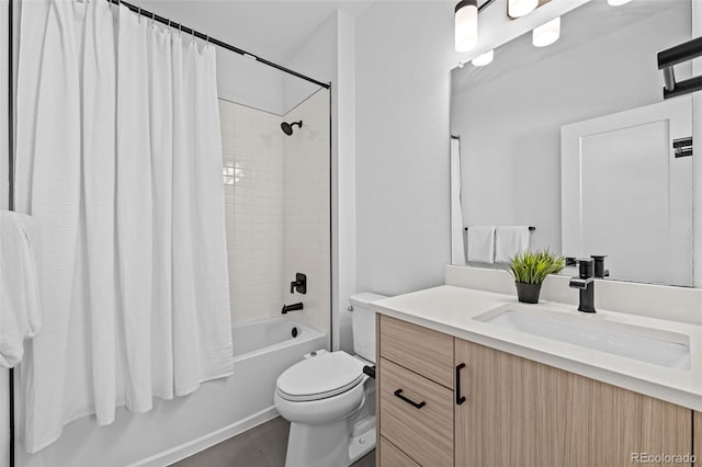 bathroom featuring shower / tub combo, vanity, and toilet
