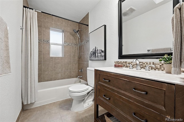 981 Ursula St, Aurora, CO 80011 - full bathroom featuring vanity, shower / bath combo with shower curtain, toilet, decorative backsplash, and a textured wall