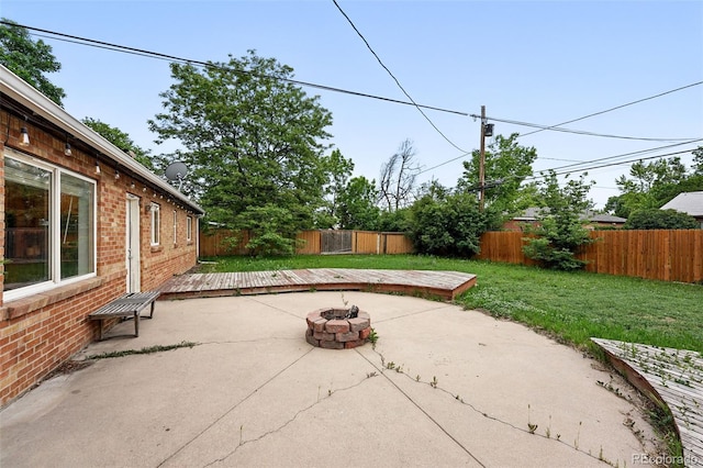 981 Ursula St, Aurora, CO 80011 - view of patio / terrace with an outdoor fire pit and a deck