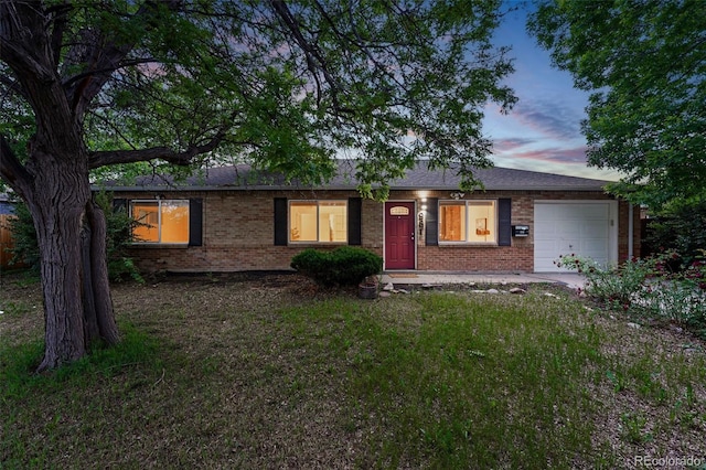 981 Ursula St, Aurora, CO 80011 - ranch-style home featuring brick siding and an attached garage