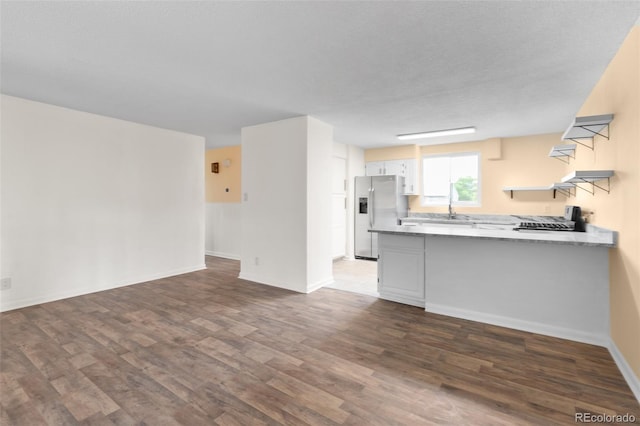 600 Bronco Rd, Denver, CO 80221 - unfurnished living room featuring dark wood-style flooring and baseboards