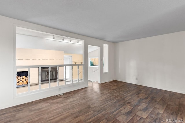600 Bronco Rd, Denver, CO 80221 - unfurnished living room with wood finished floors and track lighting