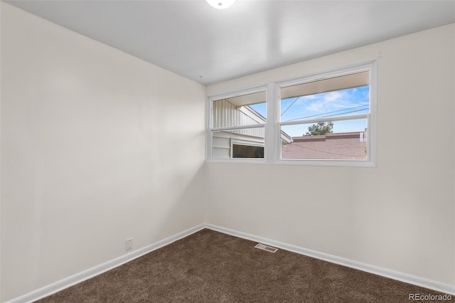 600 Bronco Rd, Denver, CO 80221 - unfurnished room featuring dark colored carpet and baseboards