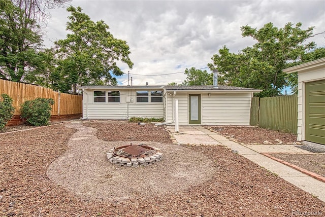 600 Bronco Rd, Denver, CO 80221 - back of house with a fire pit