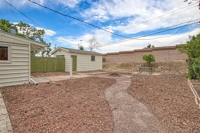 600 Bronco Rd, Denver, CO 80221 - fenced backyard featuring an outbuilding