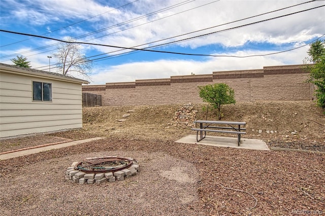 600 Bronco Rd, Denver, CO 80221 - fenced backyard with a fire pit and a patio area