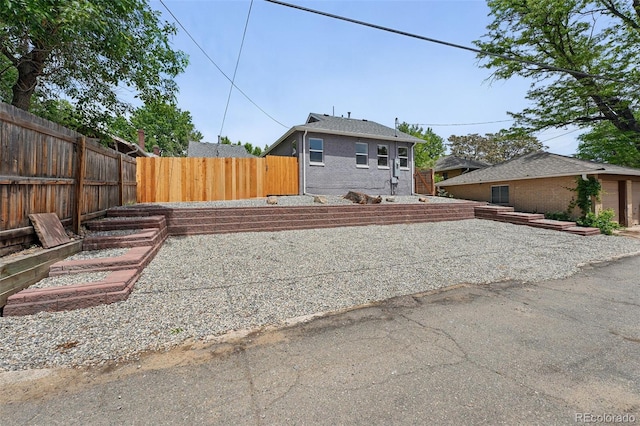 3344 W 33rd Ave, Denver, CO 80211 - rear view of property with a fenced backyard and brick siding