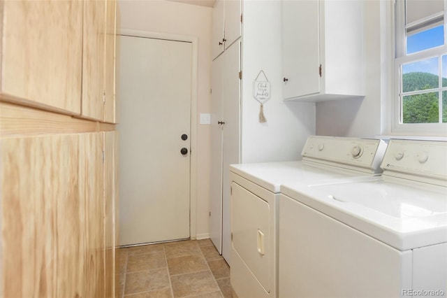 laundry area with cabinet space and washing machine and clothes dryer