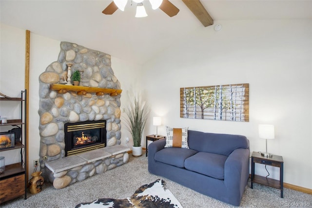 living area with baseboards, a ceiling fan, vaulted ceiling with beams, carpet floors, and a fireplace