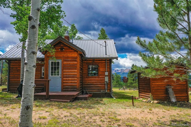 view of outbuilding featuring a mountain view