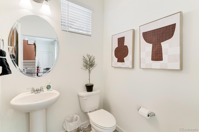 bathroom with a sink and toilet