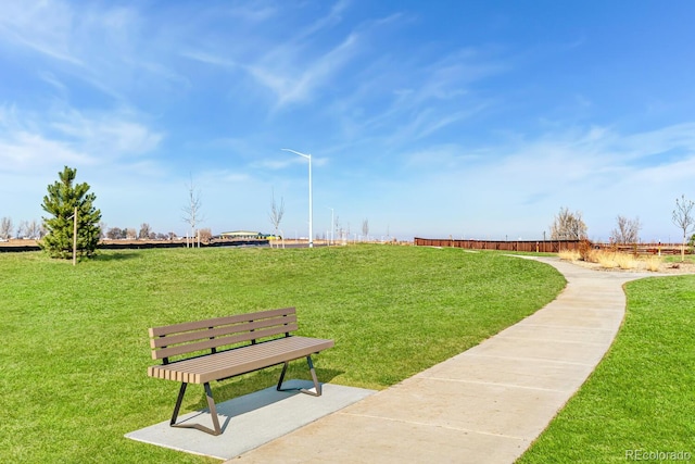 view of home's community with a lawn