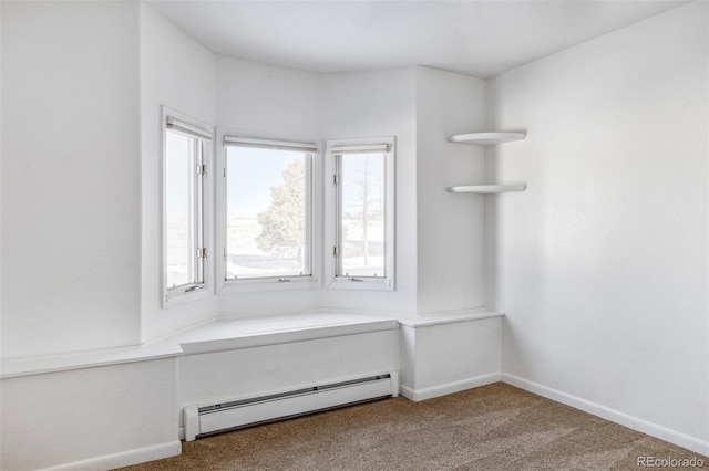 spacious closet featuring carpet floors and a baseboard radiator