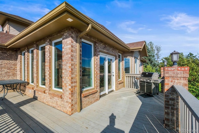 wooden deck featuring grilling area