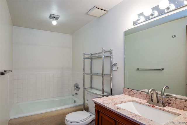 bathroom with toilet, a bathing tub, and vanity