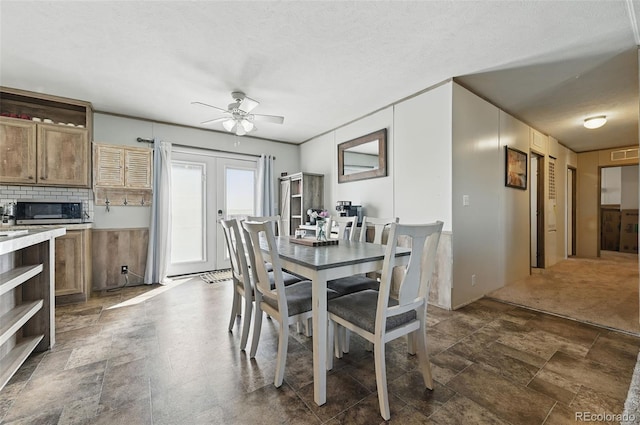 30890 Ken Vw, Yoder, CO 80864 - dining room featuring a ceiling fan, dark stone finish floors, and a textured ceiling