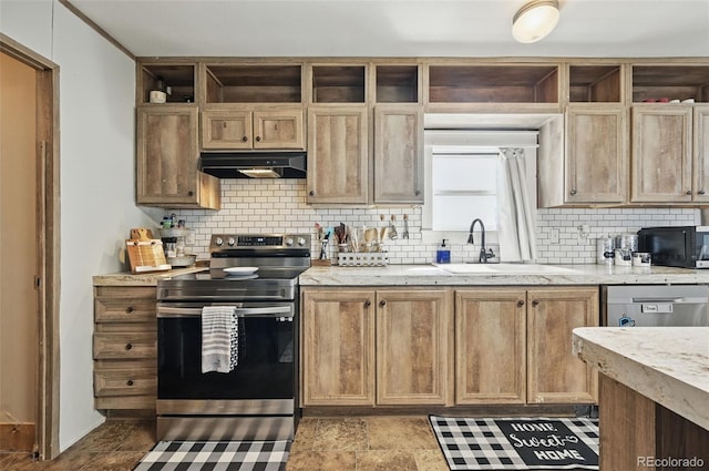 30890 Ken Vw, Yoder, CO 80864 - kitchen featuring stainless steel appliances, under cabinet range hood, a sink, and decorative backsplash