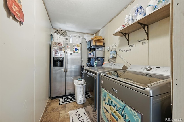 30890 Ken Vw, Yoder, CO 80864 - washroom featuring separate washer and dryer and stone finish flooring
