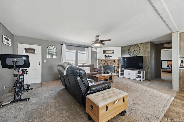 30890 Ken Vw, Yoder, CO 80864 - living room with a ceiling fan and a glass covered fireplace