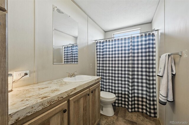 30890 Ken Vw, Yoder, CO 80864 - full bath with vanity, toilet, stone finish flooring, and a shower with shower curtain