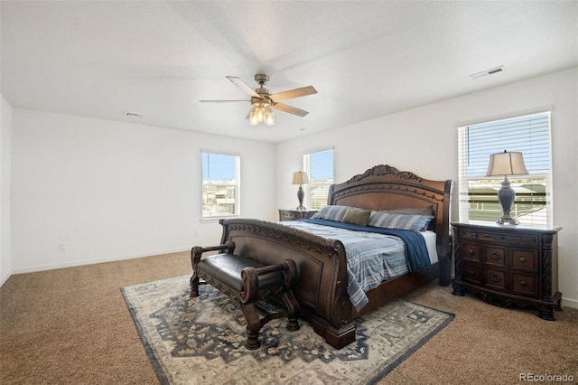 bedroom featuring light colored carpet and ceiling fan