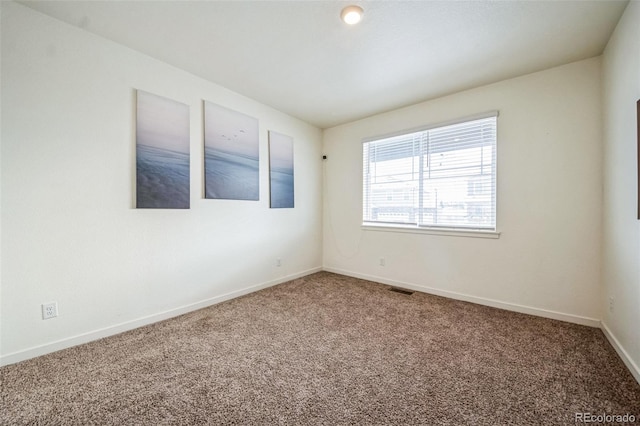 empty room featuring carpet floors