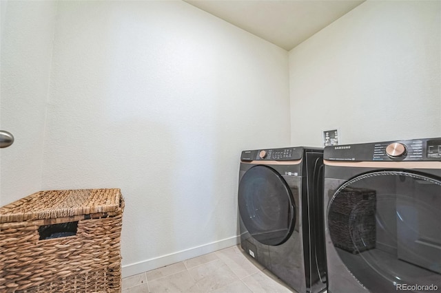 laundry area with separate washer and dryer