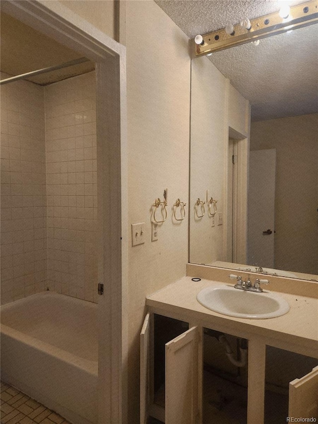 805 E 7th Ave Unit 8, Denver, CO 80218 - full bath with a sink, a textured ceiling, and  shower combination