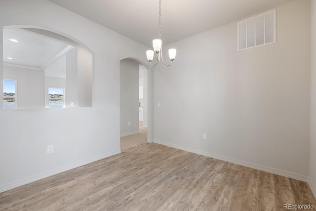 unfurnished room with light wood-type flooring