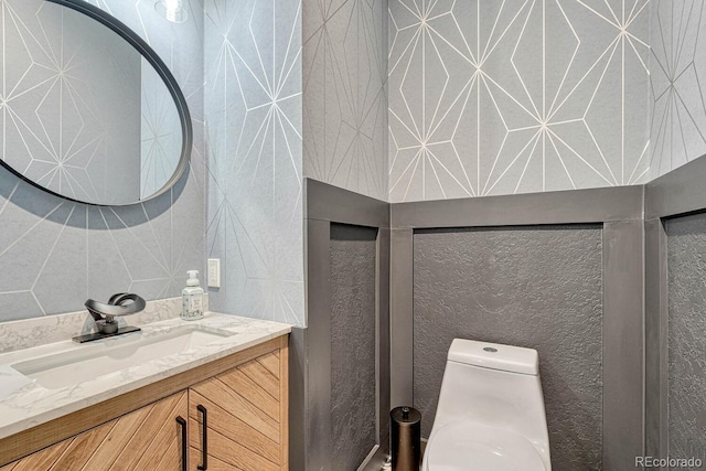 bathroom with vanity and toilet