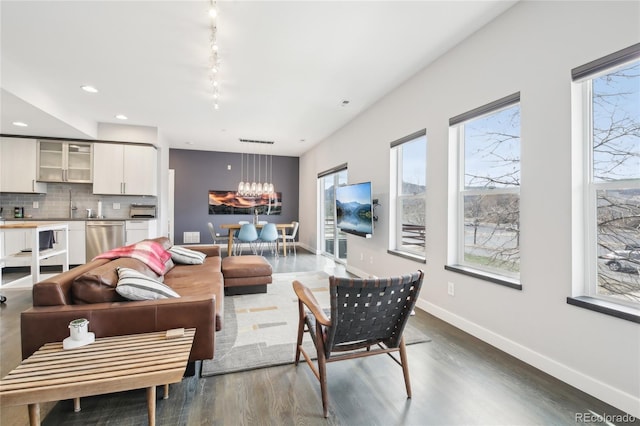 3644 Pinedale St, Boulder, CO 80301 - living room featuring plenty of natural light, a chandelier, dark wood-style floors, baseboards, and recessed lighting