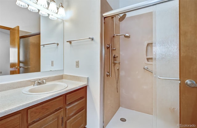full bath with a shower stall and vanity