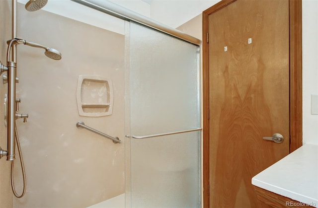full bath with a shower stall