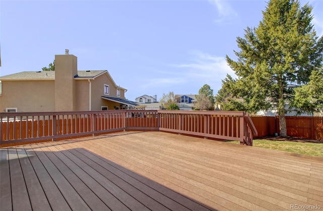 wooden deck featuring fence