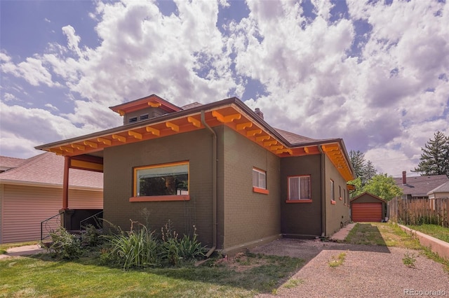 view of side of home with a lawn