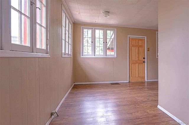 empty room with wood-type flooring