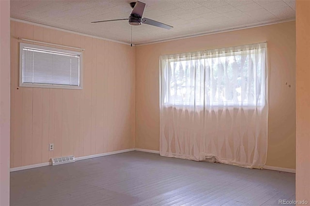 unfurnished room featuring ceiling fan and hardwood / wood-style flooring