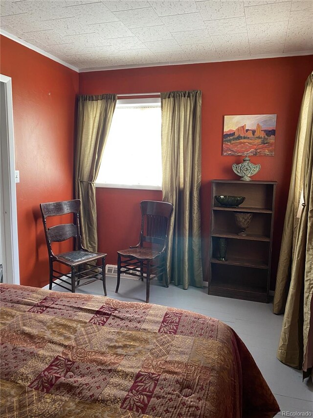 bedroom with ornamental molding