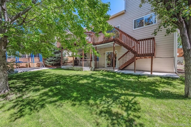 view of yard with a patio area and a deck