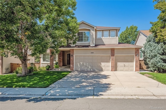 view of front of property featuring a garage and a front lawn