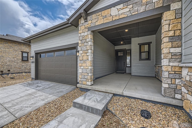 doorway to property with a garage