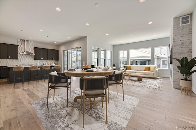 dining space featuring light hardwood / wood-style floors